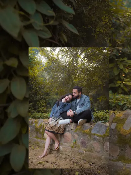 A tender moment of rest during their pre-wedding shoot. Her head on his shoulder shows the trust and comfort they find in each other.