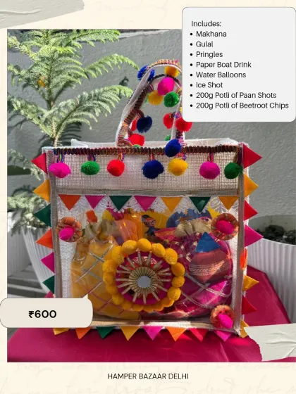 Our Jute Bag Holi Hamper is a steal at ₹600. It's packed with snacks, drinks, gulal, and water balloons, making it a complete and affordable gift for Holi parties or as a return favor.
