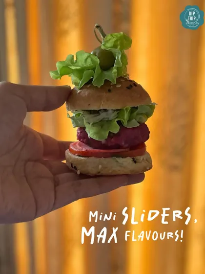 Mini sliders, maximum flavor. This image perfectly captures the handcrafted nature of each slider, showing how much deliciousness I can pack into one small, perfect bite. They are a star appetizer for any grazing table.