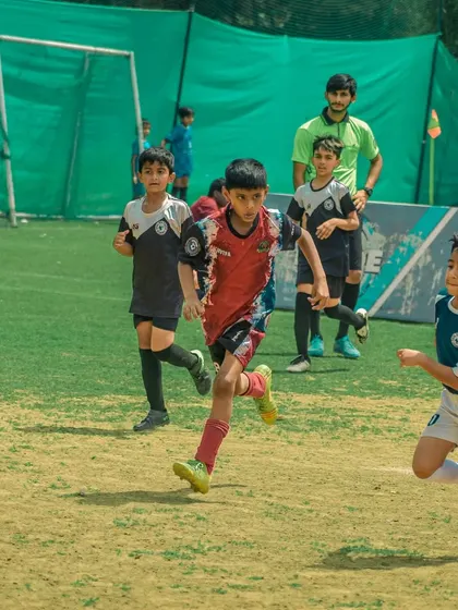 A player runs onto a through ball, leaving defenders behind.