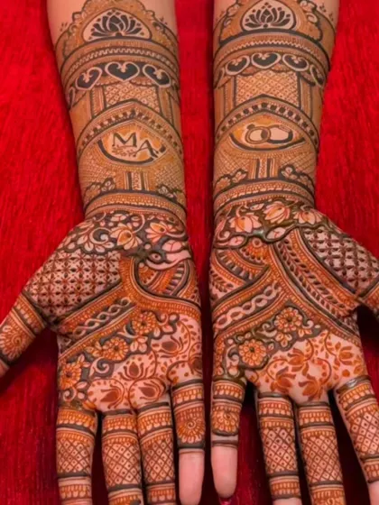 Simple and elegant engagement mehndi. This design features the couple's initials and engagement rings, surrounded by beautiful floral and geometric patterns.
