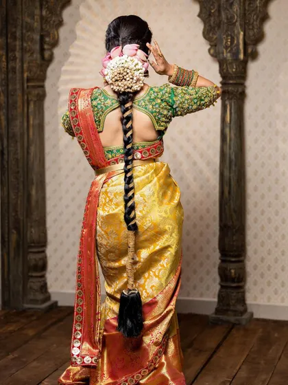 This detailed photoshoot showcases a complete South Indian bridal look, from the intricate matha patti and layered necklaces to the flawless airbrush makeup and traditional saree draping.