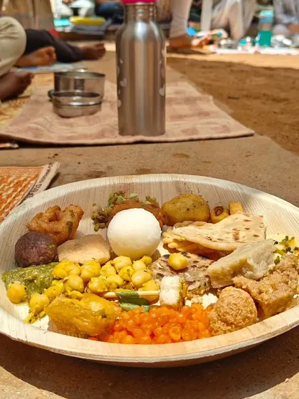 A plate of food from our Independence Day potluck, featuring dishes from various cultures across India. We celebrate diversity through shared food and stories.