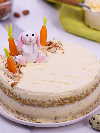 We elevate a classic with our Easter carrot cake. This moist, layered cake is topped with a delightful fondant bunny and carrots, combining timeless flavor with charming, handcrafted decorations for a perfect holiday dessert.