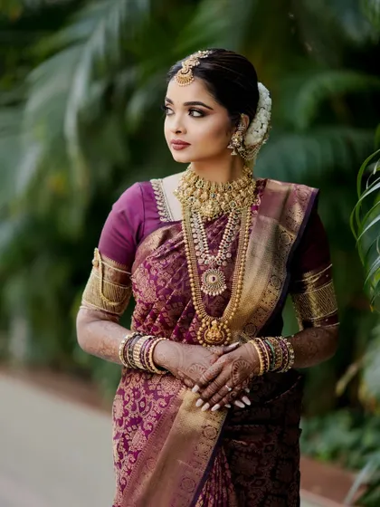 The complete picture of elegance. Shloka's South Indian bridal look is a testament to grace, with every element from her makeup to her hair and jewellery working in perfect harmony.