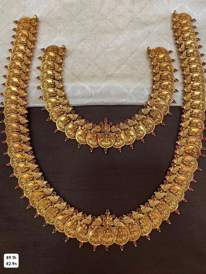 A bridal set featuring a short and long Kasina Sara (coin necklace). Both pieces are crafted from 92.5 silver with gold plating and feature intricate details.