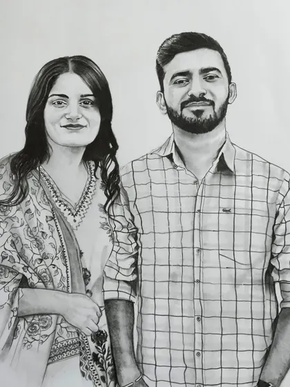A charcoal paper drawing of a couple, size 14x16 inches. Using charcoal allows for deeper blacks and softer shading, which gives the portrait a distinct look.