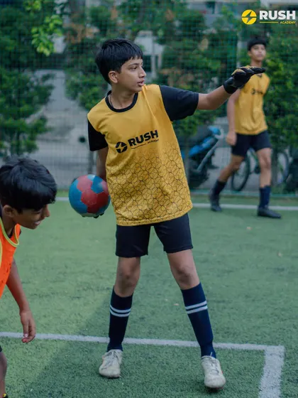 A goalkeeper calling out instructions to his defense. Communication is a key skill for every player.