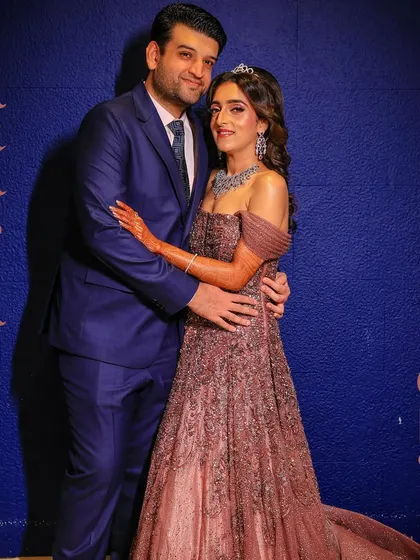 A stylish photo-op from the "Arabian Night" Sangeet, showcasing the couple's elegant evening wear.