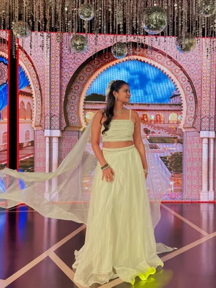 Another angle of my ethereal white outfit for the Sangeet, with the cape flowing against the beautifully lit stage.