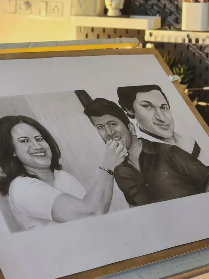 The finished tribute portrait on my drawing board, showing the three figures blended together seamlessly.