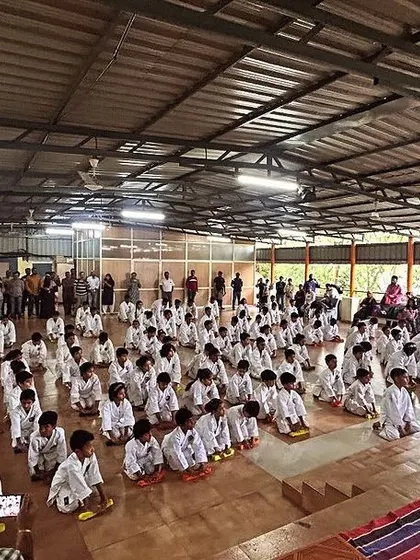 A hall full of students ready to be promoted to their next belt level. Our grading events are a testament to the growing strength and skill within our club.