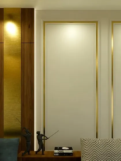 A detail shot of the wall paneling, which combines wood with brass inlay for a touch of subtle, modern luxury.