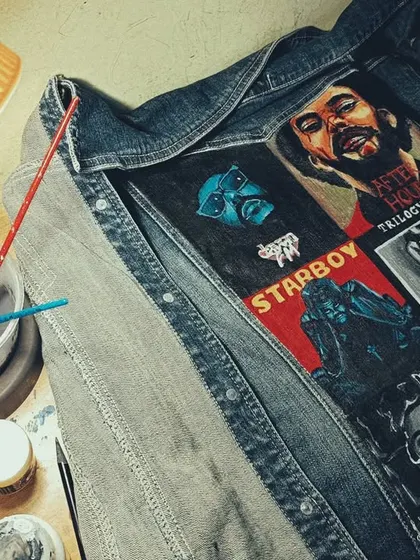 A behind-the-scenes shot of The Weeknd jacket in progress. Here you can see my workspace with my paints and brushes, right in the middle of bringing the album art to life.