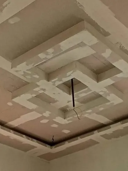 A multi-layered square design taking shape. This kind of work requires precise measurements to ensure all lines are perfectly parallel and clean.