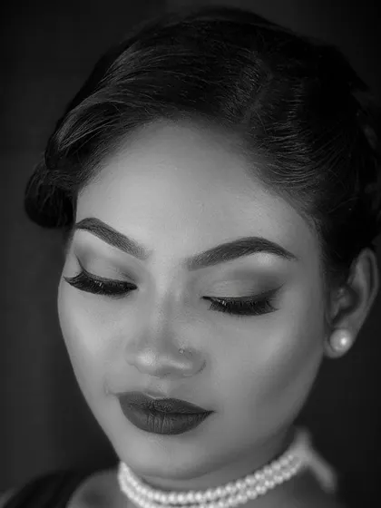 A black and white portrait of a classic vintage makeup look. I teach students how to create timeless styles, including the soft waves, defined brows, and matte lips characteristic of the 1920s and 30s.