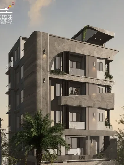 This angle of the 40x40 contemporary home emphasizes its verticality and the interplay of different textures, from the smooth concrete to the marble-finish panels.