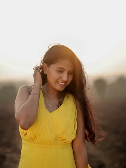A beautiful, happy portrait in the yellow tail gown. The vibrant color is sure to bring a joyful and sunny vibe to your photos.
