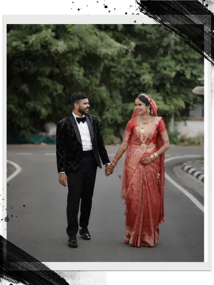 A stylishly framed shot of the couple walking down a road, with an artistic border that gives it a modern, edgy feel.