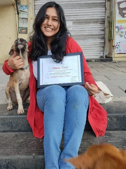 Celebrating my certification as a professional canine trainer with the best audience possible: a pack of friendly street dogs. This moment perfectly captures my love for all dogs and my mission to make their lives better through understanding.