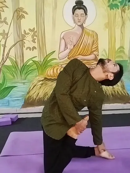 This advanced hip-opening and quad stretch shows the level of flexibility that can be achieved through a dedicated practice. I guide students towards their goals safely.
