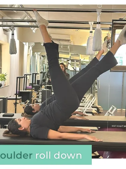 The shoulder roll down on the Cadillac is a beautiful exercise for articulating the spine and strengthening the core. It teaches you to move with flowing grace while sculpting the abdominal muscles and improving spinal flexibility.