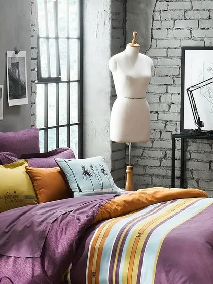 The "after" shot of a perfectly made bed in a "His & Her" collection. This establishes the aesthetic of the collection before we introduce the human element, showing the product in its ideal state.