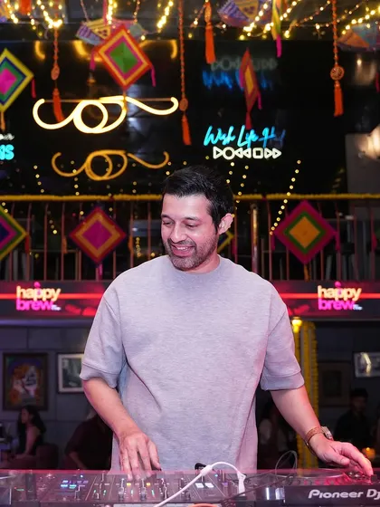 A candid shot of me at the decks during a combined karaoke and ladies' night at Happy Brew.