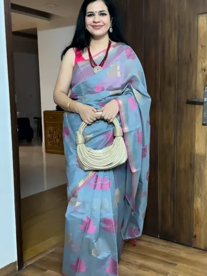 This grey and pink Banarasi saree is a beautiful piece. The combination of the subtle grey with pops of pink makes it very unique and eye-catching.
