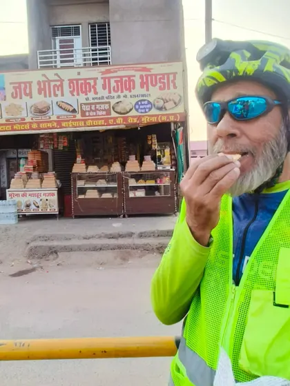 Ansari Ji, our 78-year-old Super Randonneur, enjoying a local sweet (Gajak) in Morena during his 600km BRM ride.