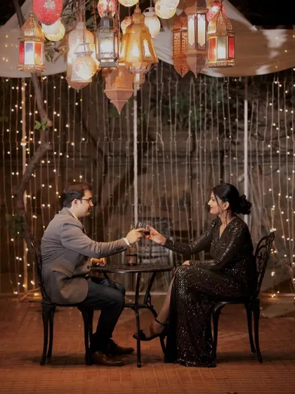 A romantic dinner scene. The makeup is glamorous and sophisticated, perfect for an elegant evening setting.