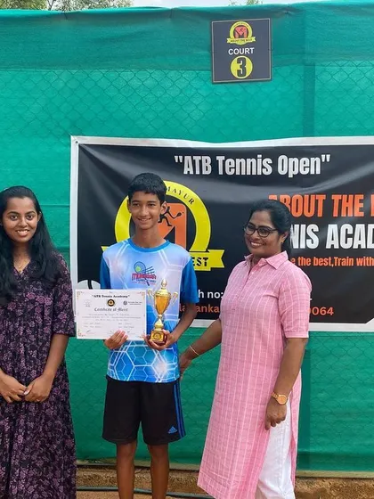 A young winner is awarded his trophy by our tournament staff.