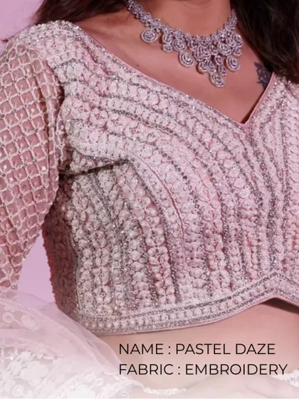 Pastel Daze. This close-up shows the delicate, textured embroidery on this pastel-colored blouse, perfect for a soft and romantic look.