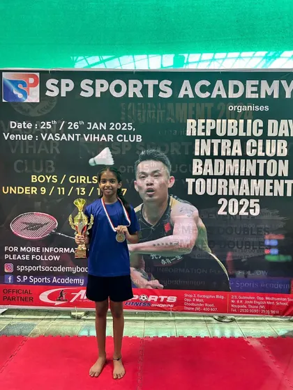 Avery Sapkal, the runner-up in the U-9 Girls category, with her award.