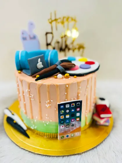 A different angle of the creative artist-themed cake.