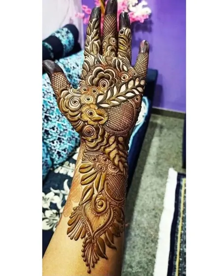 This design features a peacock-inspired pattern, with detailed feathers and floral elements.