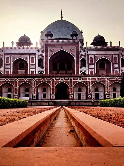 The grand facade of Humayun's Tomb, a UNESCO World Heritage site. The symmetry and scale of this red sandstone and marble structure represent a high point in Mughal architecture, a subject we delve into deeply during our walks through Delhi's imperial landscapes.