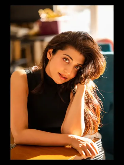 Capturing a candid moment with Pranitha Subhash. The warm, late afternoon sun provides a beautiful, natural key light, creating a soft and inviting portrait.