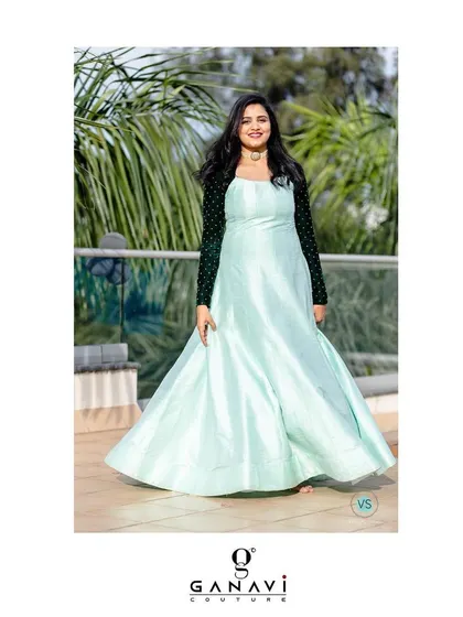 A breath of fresh air. This client is wearing a single-piece, jacket-paneled gown in a lovely mint green, paired with contrasting dark green sleeves for a modern touch.