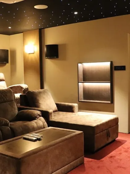 A side view of the Salem theater, showing the comfortable chaise lounge and recliner combination, as well as a stylishly lit display niche for decor.