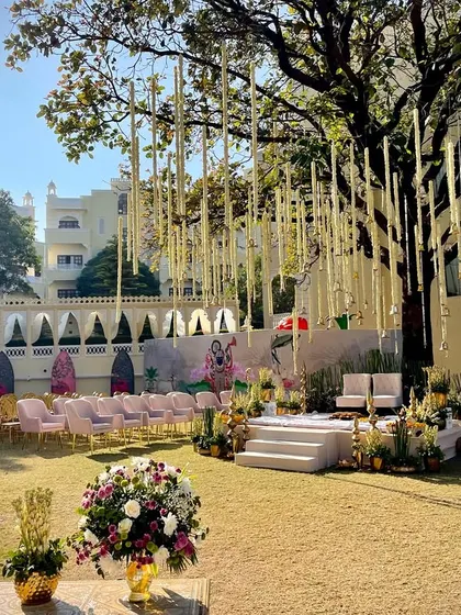 Another perspective of the stunning outdoor mandap, showing the guest seating arrangement and the beautiful natural surroundings of the Kumbhalgarh venue.