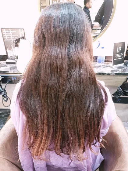 The "before" shot for a Hair Botox treatment, showing wavy and slightly frizzy hair.