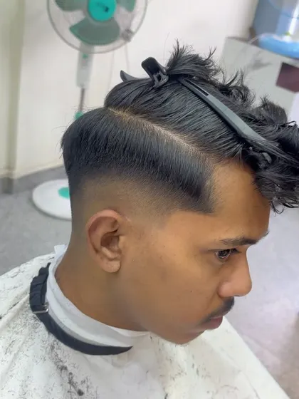 Sectioning the hair before starting the cut.