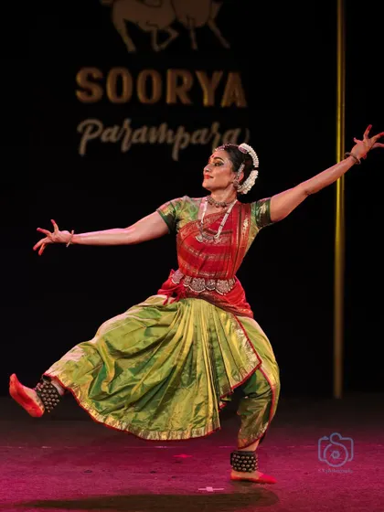 A wide, powerful stance from the Soorya Parampara Festival, showcasing the dancer's control.