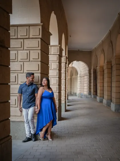 Using the beautiful arches of a classic Mumbai building to frame this couple's pre-wedding portrait. The architecture adds a sense of grandeur and timelessness to their love story.