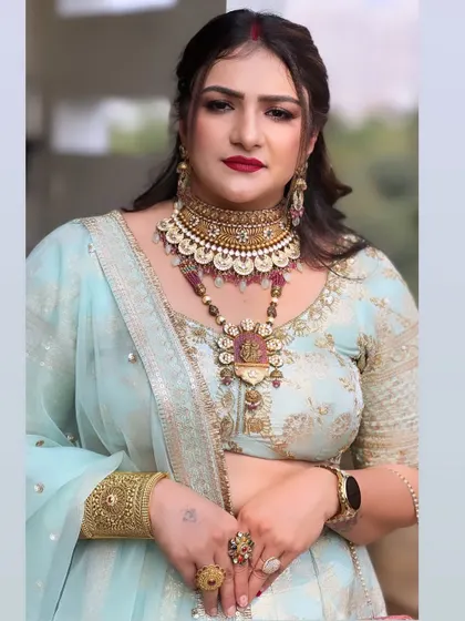 A beautiful makeup look for a party. The client looks stunning in a light blue lehenga with bold red lips.