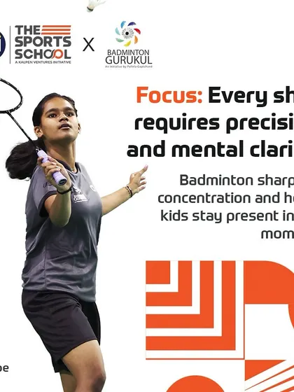 A female badminton player prepares for a shot, illustrating the focus and mental clarity that badminton develops in our athletes.