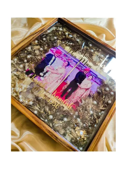 A love story that never fades. This anniversary frame was created to honor a couple's long journey together, using their original varmala and photos to create a piece full of history and love.