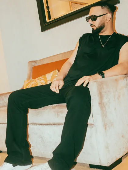 A full-length shot showing off the relaxed, all-black style I often rock when I'm not on stage. Comfort and style are key.