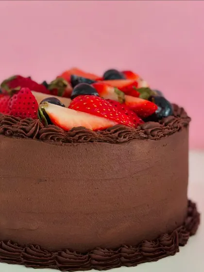 A cake you won't forget. My Strawberry Symphony cake combines a vanilla sponge, fresh strawberries, and rich chocolate frosting for a truly delicious experience.